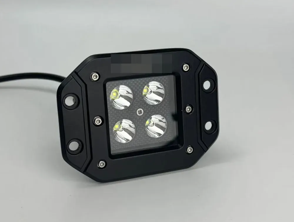 Flush-mount LED pod light built as a private label order, the customer's own logo silkscreened on the bezel and redacted here
