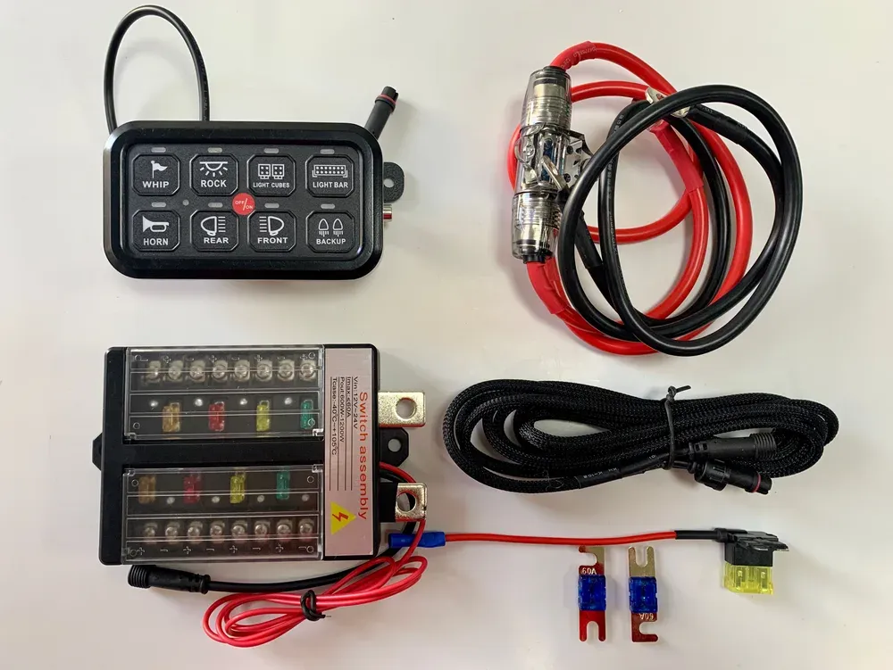Wired 8-gang switch panel kit: control box with two rows of blade fuses under clear covers, dash panel, battery leads with inline fuses and braided signal cable
