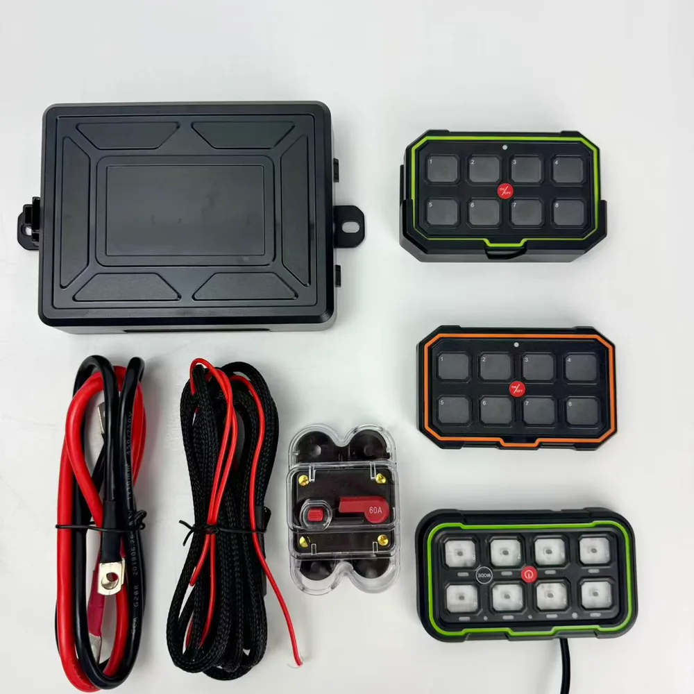 TC-SW8W kit laid out: control box, switch panels in green and orange finish, battery leads and 60A breaker